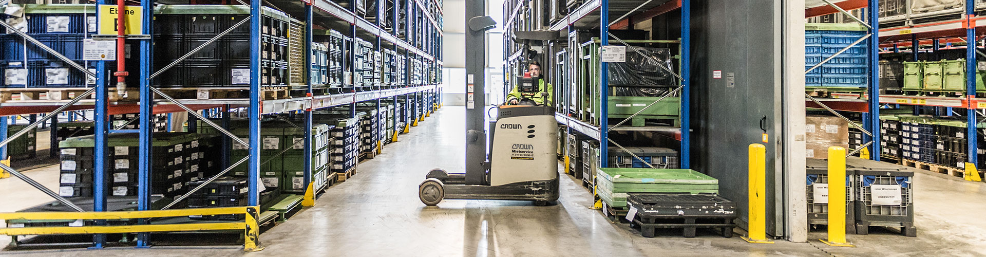 Forklift driver in warehouse